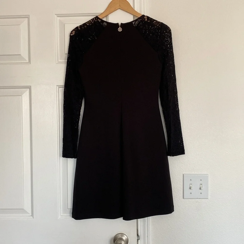 Tommy Hilfiger little black dress with long sleeves lace sleeves.